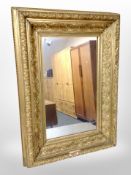 A 19th century gilt gesso-framed mirror, 65cm x 45cm.