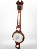 A reproduction barometer with silvered dial.