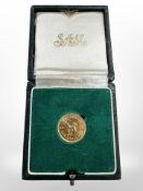 A 1966 Rhodesia 22ct gold ten shilling coin, 4g, in green box.