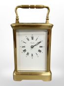 A French brass-cased carriage clock signed Angelus, eleven jewel movement with platform escapement,