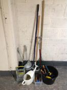 Group of garden tools, watering cans,