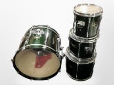 A Pearl drumkit bass drum and three further drums.