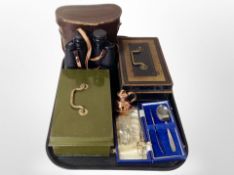 A pair of Prinz 12 x 50 binoculars, two enameled metal cash tins, cutlery,
