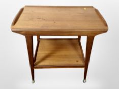 A 1970's teak two tier serving trolley,