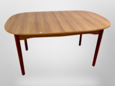 A teak effect extending dining table,