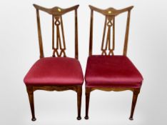 A pair of Edwardian oak Arts & Crafts salon chairs