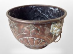 A 19th century copper jardiniere with lion mask handles, diameter 28cm.