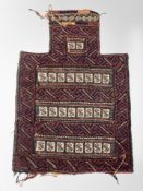 An Afghan Balouch saddle cover, 56cm x 38cm.