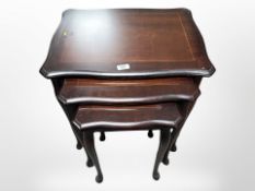 A reproduction nest of tables,