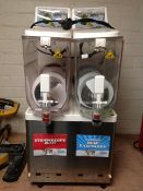 A commercial stainless steel slushie machine