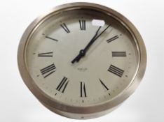 A chrome-cased circular quartz wall timepiece signed Merser England, diameter 22cm,