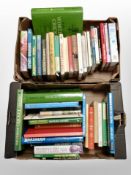Two boxes of books relating to cricket.