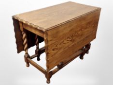 An oak pie-crust edge gate leg table,