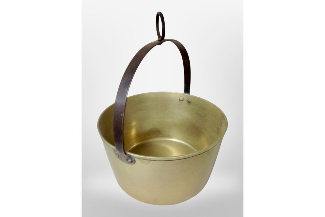 A large Victorian brass jam pan with cast iron handle, diameter 34cm.