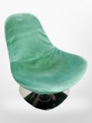 A 20th century swivel egg chair on polished chrome support