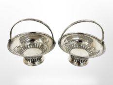 A pair of silver swing handled bon bon baskets, Birmingham 1907.