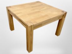 A contemporary oak square lamp table, 76cm wide x 52cm high.