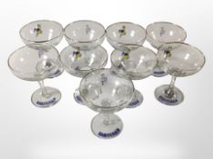 A set of eight Babycham glasses.