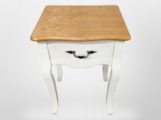 A contemporary pine-topped bedside stand, 38cm x 31cm x 55cm.