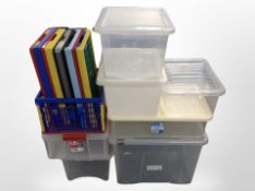 A quantity of plastic storage boxes.