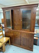 A contemporary stained pine dresser, 175cm x 47cm x 196cm.