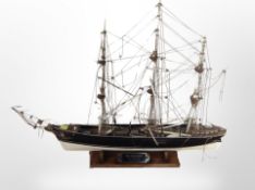 A model of the Cutty Sark on plinth, length 50cm.