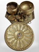 A heavily engraved brass octagonal tray, together with a further embossed charger,