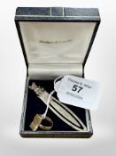 A sterling silver bookmark, together with an antique 9ct gold ring.