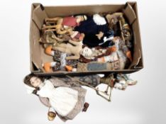 A box containing assorted dolls, Thai silhouette puppet, etc.