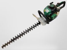 A Gardenline petrol hedge trimmer.