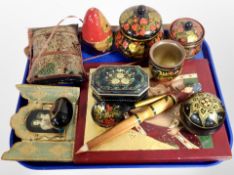 A contemporary Russian painted icon together with lacquered boxes, Babushka doll.