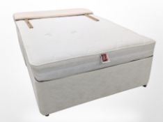 A 4' divan with upholstered headboard.