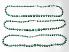 Three graduated malachite necklaces.