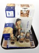 A Goebel limited edition figure of a boy carrying an umbrella,