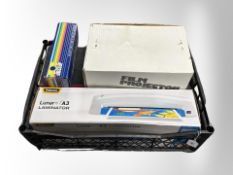 A box containing film projector, slide duplicator, laminator.