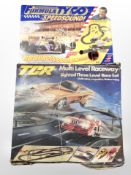 A Formula Tyco racing set and a TCR racing set.