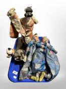 A tray of Eastern dolls and puppets.
