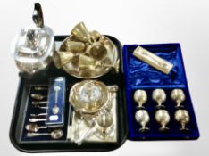 A silver-plated teapot, together with various spoons, a chamber stick, set of engraved goblets, etc.