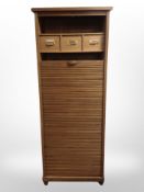 An early 20th-century oak tambour-front office pedestal cabinet, 64cm x 51cm x 169cm.
