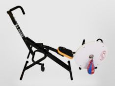 An exercise bike, and a boxing speed bag.