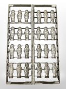 A folding metal chocolate mould, length 43cm.