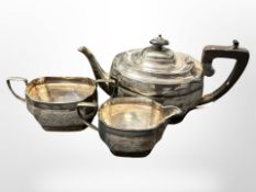 A three-piece silver-plated tea service.