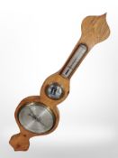 A banjo barometer with silvered dial, height 95cm.