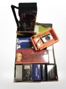 A box of classical CD box sets, camera, radio, etc.