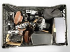 A crate of assorted vintage cameras including Chinon, Pentax, Polaroid, a boxed camera gimbal head.