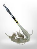 A fly-swish with beadwork decoration.