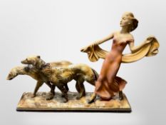 An Art Deco chalk figure group of a lady walking Borzoi dogs, length 62cm.
