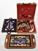 Two butterfly wing serving trays together with a canteen of Siam brass cutlery