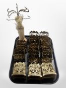 A group of thirteen cast-brass desk stands and a jewellery stand in the form of a mannequin.