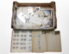 A box of stamp albums and loose stamps
